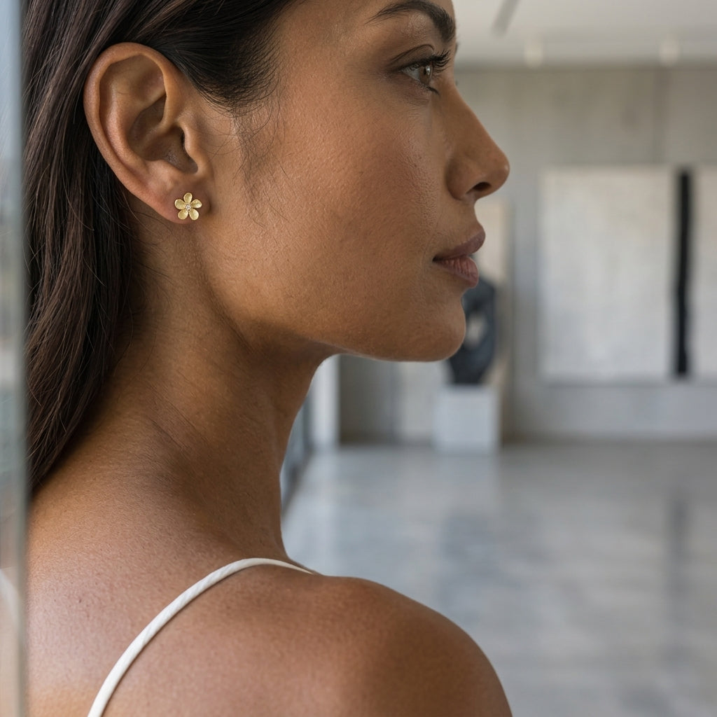 14k 6mm Plumeria Earrings with 2 Diamonds — worn on model (brunette, view 2)