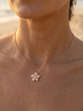 15mm 14k Plumeria Slide with diamond — close-up on model