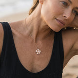14k 15mm Plumeria Pendant with 0.04 Carat Diamond — worn on model (blonde, view 3)