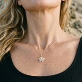 14k 15mm Plumeria Pendant with 0.04 Carat Diamond — worn on model (blonde, view 4)
