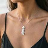 Precious Silver 3 Plumeria Slide Pendant with 3 White Sapphire — worn on model (brunette, view 4)