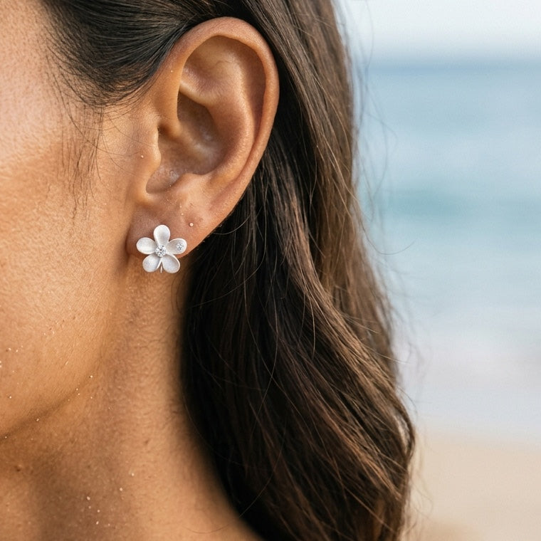 11mm Precious Silver Plumeria Earrings with 2 White Sapphire — worn on model (brunette, view 3)