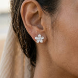 11mm Precious Silver Plumeria Earrings with 2 White Sapphire — worn on model (brunette, view 4)