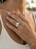 11mm Precious Silver Plumeria Ring with 3 White Sapphire — close-up on model