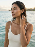 11mm Precious Silver Plumeria Ring with 3 White Sapphire — worn on model (brunette, view 1)