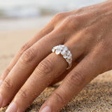 11mm Precious Silver Plumeria Ring with 3 White Sapphire — worn on model (brunette, view 3)