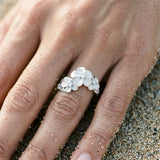 11mm Precious Silver Plumeria Ring with 3 White Sapphire — worn on model (brunette, view 4)