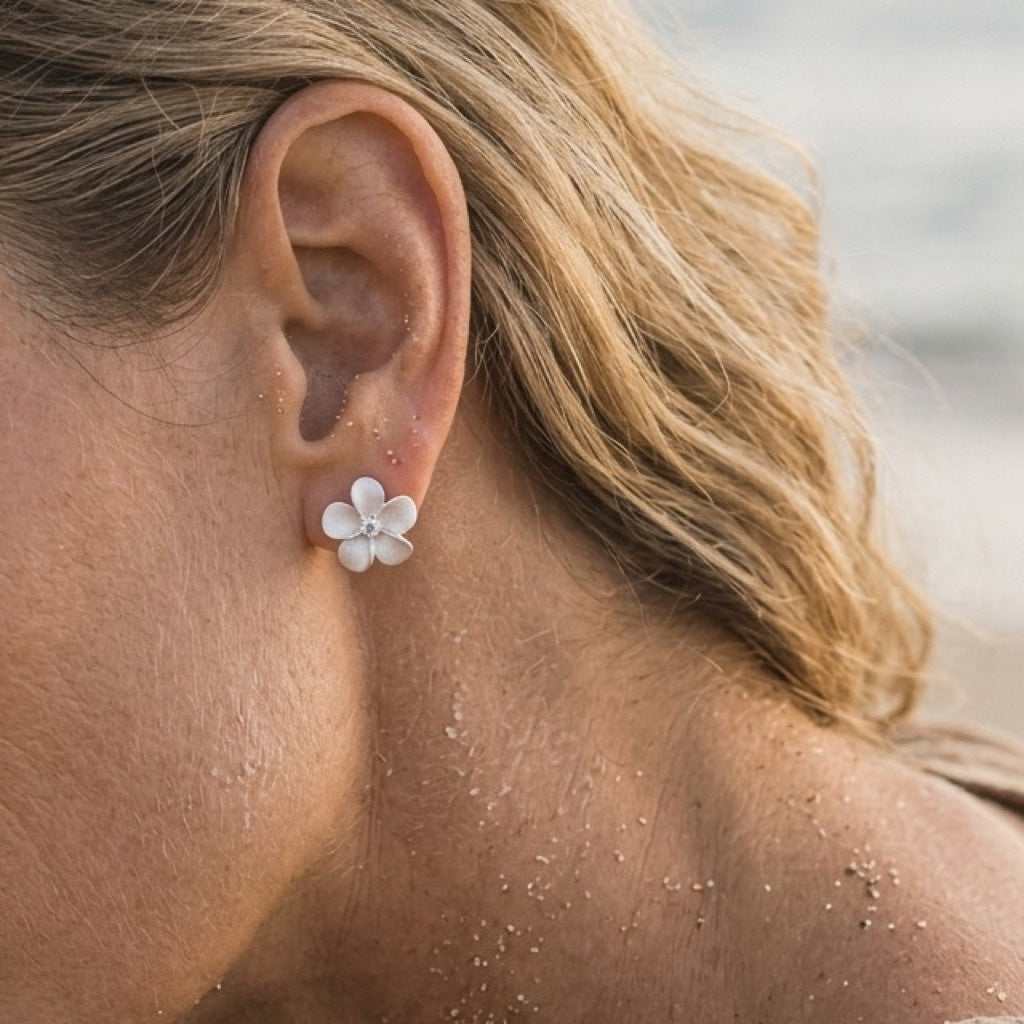 Precious Silver 11mm Plumeria Earrings with 2 White Sapphire — worn on model (blonde, view 3)