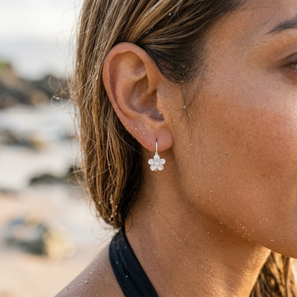 Precious Silver 8mm Plumeria Earrings with 2 White Sapphire — worn on model (brunette, view 3)