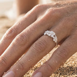 8mm Precious Silver Plumeria Ring with 3 White Sapphires — worn on model (blonde, view 4)