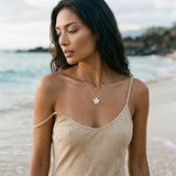 Precious Silver 13mm Plumeria Slide with White Sapphire — worn on model (brunette, view 1)