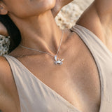 14k 22mm Crab Pendant with 2 Diamonds and 1 Tanzanite — worn on model (brunette, view 4)