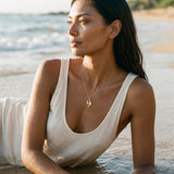 14k Mother and Baby Seal Pendant with 4 Diamonds — worn on model (brunette, view 1)