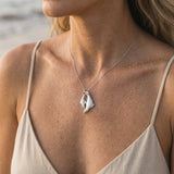 14k White Rhodium Mother and Baby Seal Pendant with 4 Diamonds — worn on model (blonde, view 4)