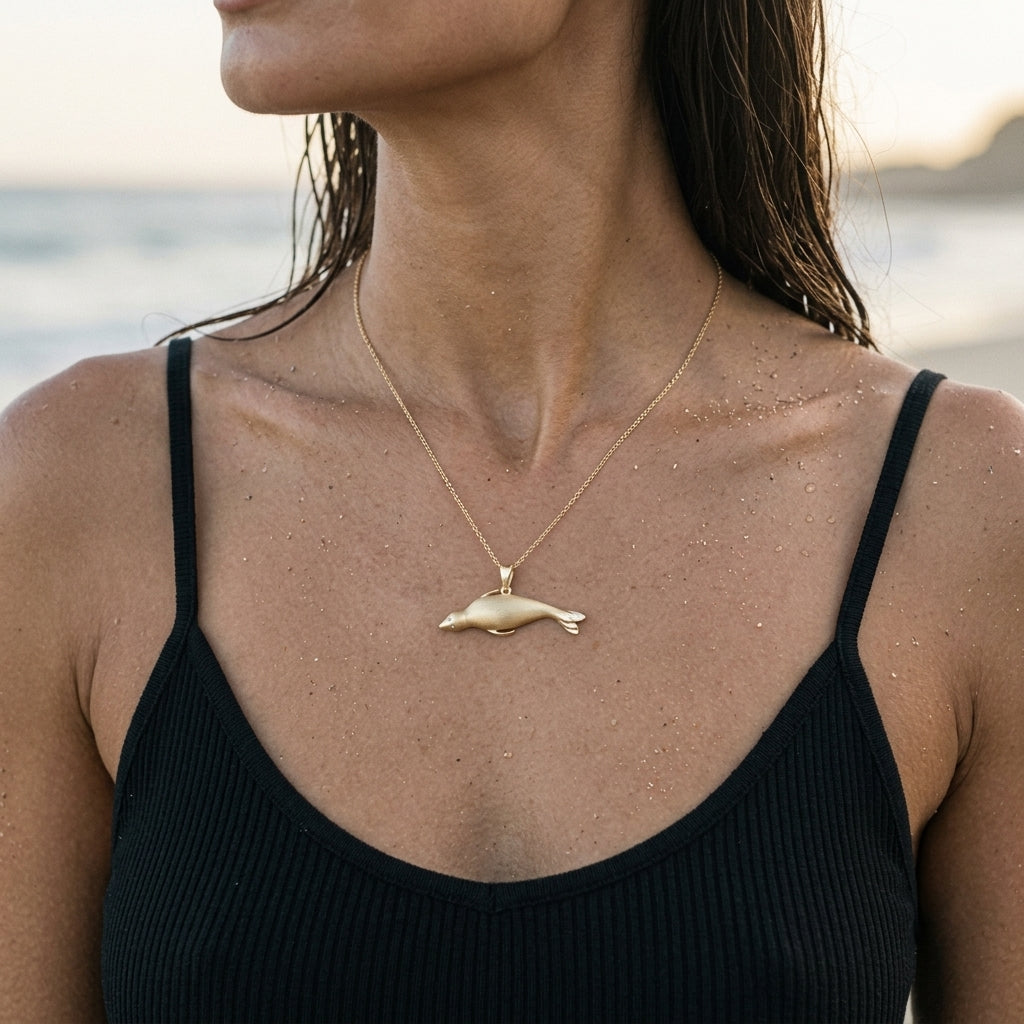 14k 40mm Seal Pendant "Searching" with 2 Diamonds — worn on model (brunette, view 3)