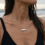 14k 40mm Seal Pendant "Searching" with 2 Diamonds — worn on model (brunette, view 4)