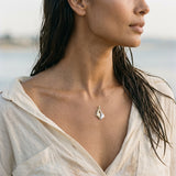 14k 2/tone 20mm Seal Pendant "Dancing Couple" with 4 Diamonds — worn on model (brunette, view 3)