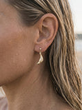 14k 20mm "Diving" Seal Ball Post Earrings with 4 Diamonds — close-up on model
