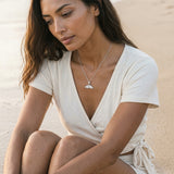 Precious Silver 26mm Whale Tail Pendant — worn on model (brunette, view 1)