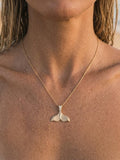 14k 25mm Whale Tail Pendant with 5 Diamonds — close-up on model