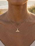 14k 15mm Whale Saw Tail Pendant with 5 Diamonds — close-up on model