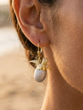 14k 20mm "Hatching" Sea Turtle Earring with 4 Diamonds — close-up on model