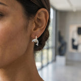 14k 15mm "Jumping Loop" Dolphin Earrings with 6 diamonds — worn on model (brunette, view 2)