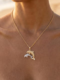 14k 2/tone 22mm "Mother & Calf" Dolphin Pendant with 2 diamonds — close-up on model