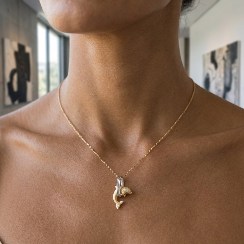 14k 15mm "Jumping Loop" Dolphin Pendant with 0.01 carat diamond — worn on model (brunette, view 2)