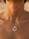 14k 20mm "Chasing Couple" Dolphin Pendant with 2 diamonds — close-up on model