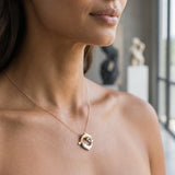 14k 20mm "Chasing Couple" Dolphin Pendant with 2 diamonds — worn on model (brunette, view 2)