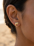 14k Stud Dolphin Earrings with 0.02 Carat Diamonds — close-up on model