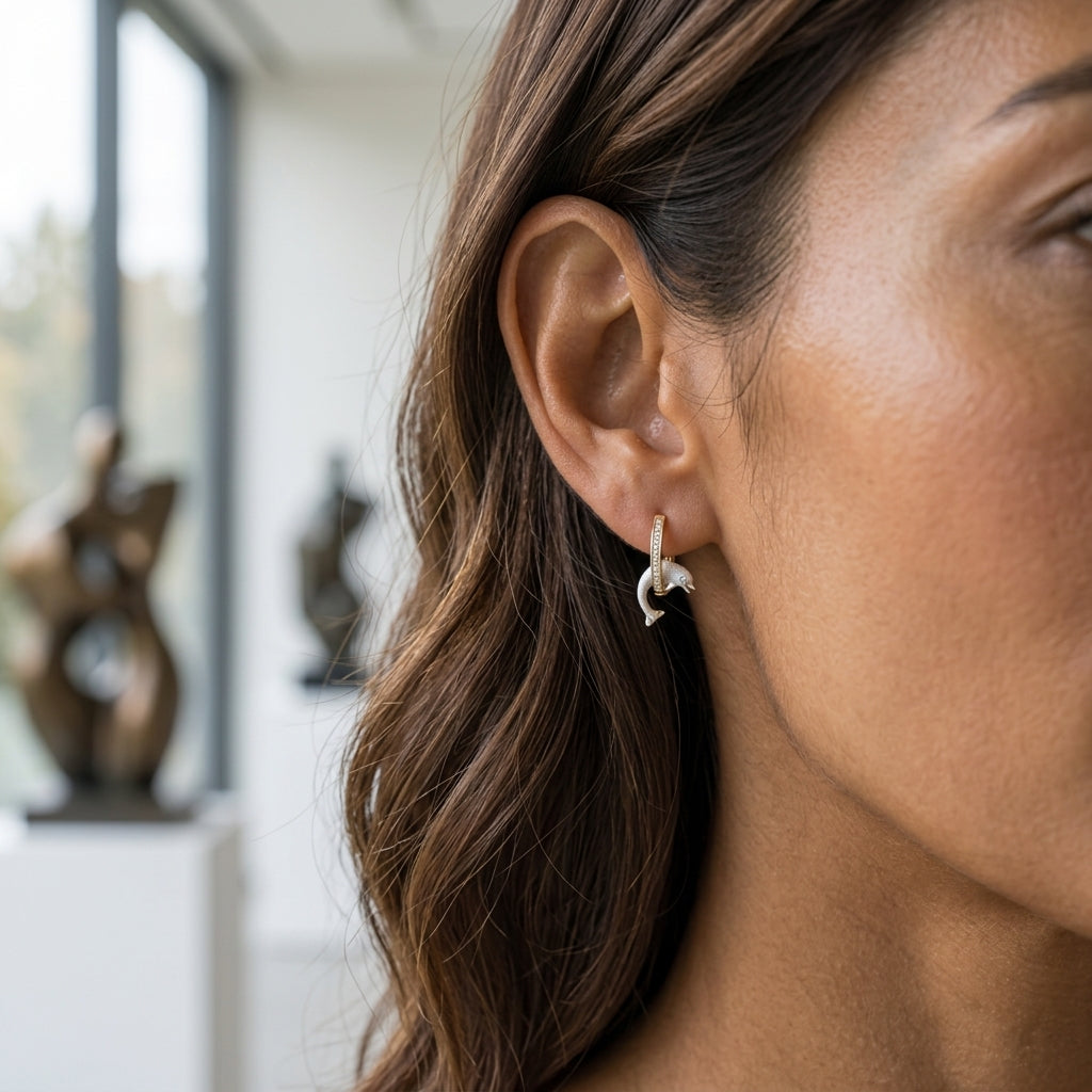 14k 15mm "Jumping Loop" Dolphin Earrings with 18 diamonds — worn on model (brunette, view 2)