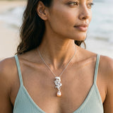 Precious Silver 20mm "Sliding Couple" Dolphin Pendant — worn on model (brunette, view 3)