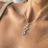 10mm Precious Silver 18k "Dancing Couple" Dolphin Pendant — worn on model (brunette, view 4)