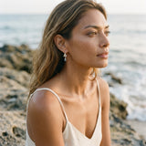 18k Precious Silver "Dancing Couple" Dolphin Leverback Earring — worn on model (brunette, view 1)