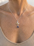 Precious Silver 18k 10mm "Dancing Couple" Dolphin Pendant — close-up on model