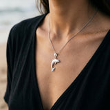Precious Silver 28mm "Jumping Single" Dolphin Pendant — worn on model (brunette, view 4)