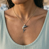 PRECIOUS SILVER/14KY (BLACK & YELLOW) 40MM BLUE MARLIN PENDANT W/2 DIA. 0.02ct T/W — worn on model (brunette, view 4)