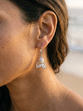 Precious Silver/18k Octopus Earring with 4 Diamonds — close-up on model