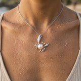 Precious Silver 22mm Crab Pendant with 2 Diamonds, Water Pearl and Tanzanite — worn on model (brunette, view 4)