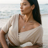 Precious Silver 15mm Dolphin Pendant — worn on model (brunette, view 2)
