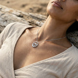Precious Silver 15mm Dolphin Pendant — worn on model (brunette, view 3)