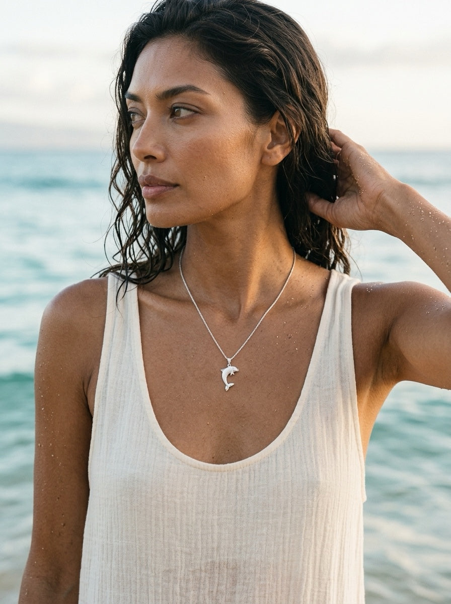 Precious Silver 20mm "Jumping Single" Dolphin Pendant — worn on model (brunette, view 1)