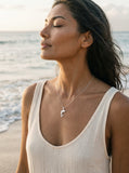Precious Silver 20mm "Jumping Single" Dolphin Pendant — worn on model (brunette, view 2)