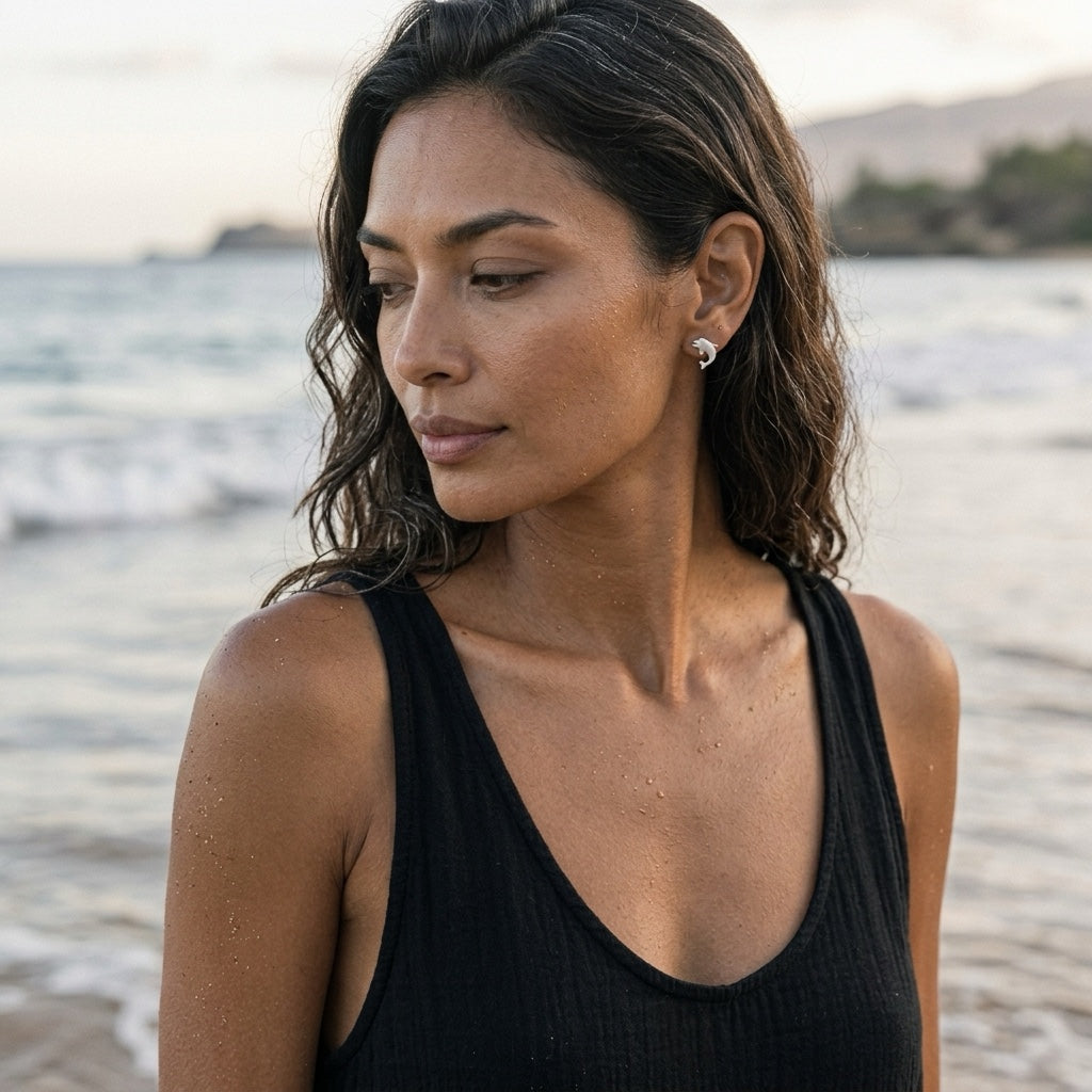 Precious Silver 10mm "Jumping Single" Dolphin Earrings with 2 Diamonds — worn on model (brunette, view 1)