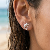 Precious Silver 10mm "Jumping Single" Dolphin Earrings with 2 Diamonds — worn on model (brunette, view 4)
