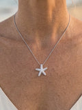 Precious Silver 18mm Starfish Pendant with White Sapphire — close-up on model
