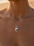 14k 17mm "Jumping Single" Dolphin Charm with 17 diamonds — close-up on model