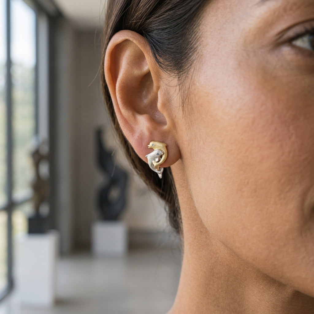 14k 15mm "Jumping Loop" Dolphin Earrings with 2 Blue Diamonds — worn on model (brunette, view 2)